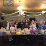 Women of the Moose volunteers pose with the Easter Baskets that they put together for the children at the AWARE shelter. Each basket was made specific to each childs age, said Jaime Isaak in an email. A lot of happy children, Isaak said. (Courtesy Photo / Jaime Isaak)