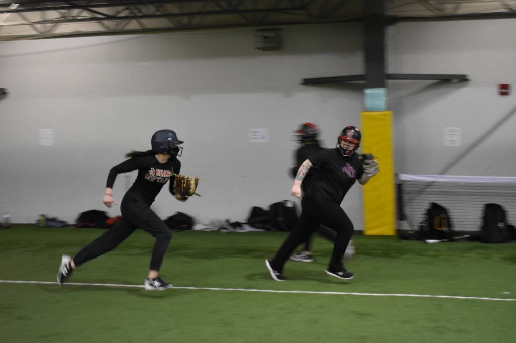 JDHS pitcher and utility player Kiah Yadao runs down Mackenzie Jackson, who plays first base, third base and right field. (Courtesy Photo / Lexie Razor)