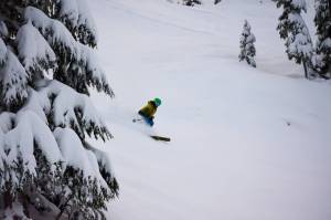 A skier makes a run at Eaglecrest Ski Area in January 2021. A perfect storm of heavy snow coupled with pandemic-weary residents eager for outside recreation resulted in an excellent season on the mountain and money in the bank. Ski area officials shared budget projections for the 2022 season with the citys finance committee Wednesday night. (Courtesy Photo / Eaglecrest Ski Area)