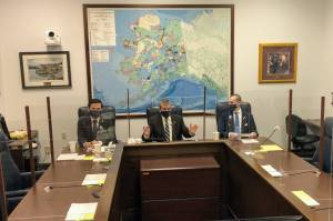 From left to right, Reps. Neal Foster, D-Nome, Chris Tuck, D-Anchorage, and Calvin Schrage, I-Anchorage, speak to reporters on Thursday, April 22, 2021. As the end of the legislative session approaches, some lawmakers are trying to speed up work on the budget. (Peter Segall / Juneau Empire)