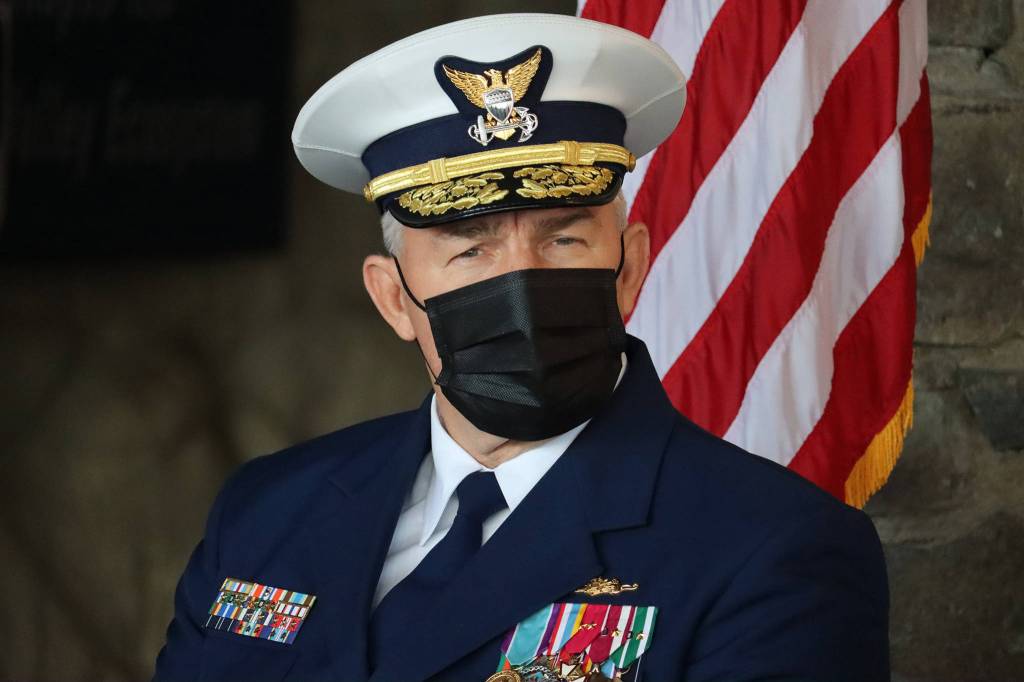 Ben Hohenstatt / Juneau Empire 
Adm. Karl L. Schultz, U.S. Coast Guard commandant, listens to a speaker during a Coast Guard District 17 Change of Command ceremony. The ceremony conformed to many traditions, but masks, a livestream and capped attendance were among measures in place to reduce risk of COVID-19 spread.
