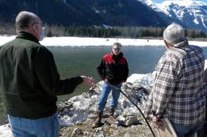 Alaska Gov. Mike Dunleavy, center, listens as residents discuss a levee they have concerns with on Thursday, April 22, 2021, in Hyder, Alaska. Hyder was among the Southeast Alaska communities that Dunleavy visited as part of a one-day trip. (AP Photo / Becky Bohrer)