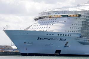 The Symphony of the Seas cruise ship is shown docked at PortMiami, in a Wednesday, May 20, 2020, photo, in Miami. Cruise lines can soon begin trial voyages in U.S. waters. Theyll have to carry some volunteer passengers, who will have to wear face masks and observe social distancing while on board. The Centers for Disease Control and Prevention gave ship operators final technical guidelines Wednesday, May 5, 2021 for the trial runs. (AP Photo / Wilfredo Lee)