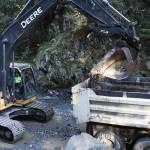 Workers with City and Borough of Juneau Parks and Recreation clear the basin at Cope Park of excess sediment and other material washed down the waterway on Sept. 16, 2020. This work is an example of one of the many varied jobs done by public servants and recognized during Public Service Recognition Week, which ends May 8. (Michael S. Lockett / Juneau Empire File)