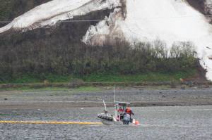 Coast Guardsmen and partner organizations practice oil spill cleanup in the Gastineau Channel near Sandy Beach on May 11. 2021. (Michael S. Lockett / Juneau Empire)