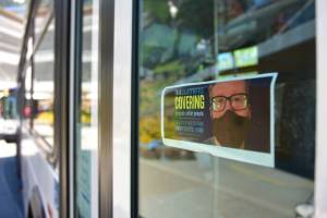 A sign downtown encourages residents to wear a face covering while in public spaces. The city announced on Tuesday it will be relaxing masking mitigation measures in spaces where people are fully vaccinated against COVID-19. (Peter Segall / Juneau Empire File)