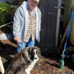Mitchell Prescott and Kéet stand in front of the smokehouse in Wrangell.