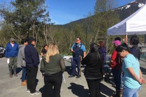 Alaska State Trooper Josh Bentz briefs volunteer searchers in the search for missing woman Geraldine Nelson on Wednesday, May 19, 2021. (Michael S. Lockett / Juneau Empire)