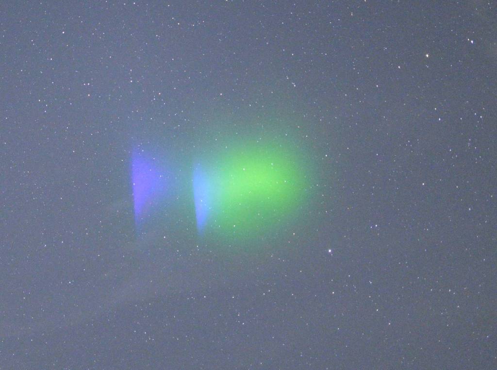 Glowing clouds created by the release of barium into the ionosphere. (Don Hampton / Geophysical Institute)