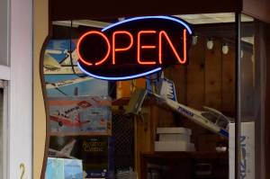 This May 2020 photo shows an open sign illuminated on a Juneau business. Alaska Department of Labor and Workforce Development reports the state has added jobs but has not yet returned to pre-pandemic levels of employment. (Peter Segall / Juneau Empire File)