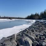 In this April 22, 2021, photo, signs of spring thaw appear along the Tazlina River in Tazlina, Alaska. The Catholic Church wants to sell 462 acres that once housed the Copper Valley mission school to the Native Village of Tazlina, a federally recognized tribe. The tribe is scrambling to raise the nearly $1.9 million asking price so it can regain stewardship of its ancestral land. (John Tierney / Indian Country Today)