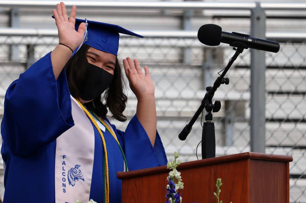 Chemery Marte, Associated Student Body Vice President, makes a celebratory gesture during her student leadership address at Thunder Mountain High Schools graduation ceremony on May 23, 2021. (Ben Hohenstatt / Juneau Empire)