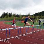 Eli Mead of Thunder Mountain High School jumps a hurdle during the Region V Track Meet at TMHS on Saturday, May 22. Mead finished first in the 300 hurdles for Region V, Division 1. (Ben Hohenstatt / Juneau Empire)