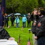 Veterans of Foreign Wars Post 5559 junior vice commander David Carroll, nearer, and post service officer Tom Armstrong, further, salute during a Memorial Day ceremony at Evergreen Cemetery on May 31, 2021. (Michael S. Lockett / Juneau Empire)