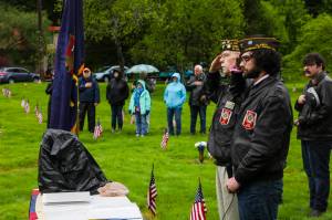Veterans of Foreign Wars Post 5559 junior vice commander David Carroll, nearer, and post service officer Tom Armstrong, further, salute during a Memorial Day ceremony at Evergreen Cemetery on May 31, 2021. (Michael S. Lockett / Juneau Empire)