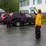 Juneau residents sing together outside the Juneau Montessori School, formerly the Mayflower School built by the Bureau of Indian Affairs, to honor the 215 dead Indigenous children found at a residential school in Canada, on May 31, 2021. (Michael S. Lockett / Juneau Empire)