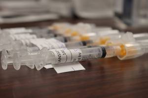 COVID-19 vaccines, like these seen at a March 13, 2021 Department of Veterans Affairs vaccine clinic, will be available at Alaska three main airports and open to anyone who wants one. (Ben Hohenstatt / Juneau Empire file)