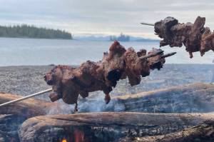 The author cooks steak over a beach fire over the Memorial Day weekend. (Jeff Lund / For the Juneau Empire)
