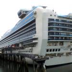 This July 26, 2017 file photo shows the Emerald Princess cruise ship docked in Juneau, Alaska. Kenneth Manzanares, charged with first-degree murder in the death of his wife Kristy while aboard the ship on a cruise to Alaska, pleaded not guilty in federal court in Juneau Wednesday, Aug. 23, 2017. Kristy Manzanares was found dead in a cabin last month on the ship while it was in U.S. waters off Alaska. (AP Photo/Becky Bohrer, File)