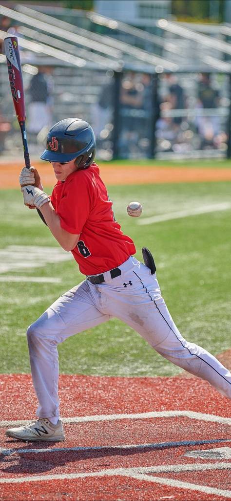 Juneau-Douglas High School: Yadaa.at Kalé baseball players Gavin Millard gets hit with the ball during the state baseball tournament. (Courtesy photo / Chad Bentz)