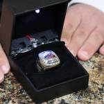David Timothy shares a close up look at a ring he earned as part of the 2016 state championship JDHS Crimson Bears team. Over the years, Timothy has supported the team as a manager, a student assistant and an adviser. Next season, he will serve as an assistant coach. His dad, Gary Timothy, said the team has been inclusive over the years, and David Timothy has shared in their success. Thats meant a championship ring, a trophy and the opportunity to cut down a net following a tournament win among other highlights. (Ben Hohenstatt / Juneau Empire)