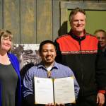 From left to right, Rep. Sara Hannan, D-Juneau; Martin Stepetin Sr. and Gov. Mike Dunleavy at a signing ceremony for a bill protecting a cemetery in Funter Bay at the Juneau-Douglas City Museum on Tuesday, June 8, 2021. (Peter Segall / Juneau Empire)