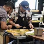 Peter Segall / Juneau Empire 
Chef Lionel Uddipa of Red Spruce and his team prepare a dish of seared Alaskan scallop with Red Spruce miso, shio koji, calamansi, candied kumquat and herring egg bottarga for a charity dinner highlight the seafood cuisines of Alaska and Louisiana at Forbbiden Peak Brewery on Tuesday.