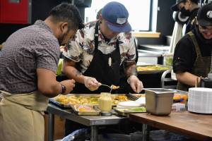 Peter Segall / Juneau Empire 
Chef Lionel Uddipa of Red Spruce and his team prepare a dish of seared Alaskan scallop with Red Spruce miso, shio koji, calamansi, candied kumquat and herring egg bottarga for a charity dinner highlight the seafood cuisines of Alaska and Louisiana at Forbbiden Peak Brewery on Tuesday.