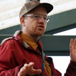 Bretwood Hig Higman, executive director of Ground Truth Trekking, talks Thursday at a news conference outside Dzantiki Heeni Middle School about the risk of an eventual landslide in the Lemon Creek area. (Ben Hohenstatt / Juneau Empire)