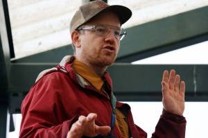 Bretwood Hig Higman, executive director of Ground Truth Trekking, talks Thursday at a news conference outside Dzantiki Heeni Middle School about the risk of an eventual landslide in the Lemon Creek area. (Ben Hohenstatt / Juneau Empire)