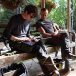 On a Fairbanks homeowners porch, Nicholas Hasson, left, and Jason Clark of UAF review results from permafrost investigations. (Courtesy Photo / Ned Rozell)