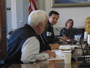 State Rep. Neal Foster, D-Nome, second from left, listens as Rep. Bart LeBon, far left,R-Fairbanks, foreground, speaks during a budget conference committee meeting in Juneau, Alaska, on Sunday, June 13, 2021. Alaska legislators who are leading negotiators on a committee tasked with hashing out differences on a state spending package said they would like to reach a tentative agreement as early as Sunday. (AP Photo / Becky Bohrer)