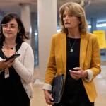 Sen. Lisa Murkowski, R-Alaska, right, speaks with a reporter while arriving for a Senate vote, Wednesday, June 16, 2021, on Capitol Hill in Washington. (AP Photo/Jacquelyn Martin)