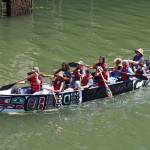 The One People Canoe Society and passengers make their way to Harris Harbor on Saturday during the Juneau Maritime Festival. (Ben Hohenstatt / Juneau Empire)