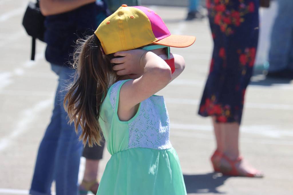 Caroline Wadlow, 6, reacts to the noise of a Coast Guard water rescue demonstration during the 11th edition of the Juneau Maritime Festival. (Ben Hohensatt / Juneau Empire)