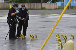 Police investigate the scene of an early morning fatal shooting along Gambell Street between Fourth Avenue and Fifth Avenue near downtown Anchorage, Alaska, Saturday, June 19, 2021. (Bill Roth / Anchorage Daily News)