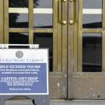 A sign invites visitors into the Alaska State Capitol building on Monday, June 21, 2021. Lawmakers will begin their second special session of the year Wednesday after Gov. Mike Dunleavy sent the state's budget bill back to lawmakers saying it lacked critical components. (Peter Segall / Juneau Empire)