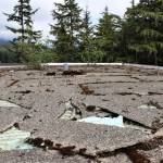 Insulation can be seen through broken shingles on the Novatney Building’s roof. Funding for maintenance work on the roof was among Gov. Mike Dunleavy’s over $215 million in budget cuts. Design work for the effort has long been completed, said UAS facilities maintenance and operations manager Adam Zenger. The roof does not currently leak, he said, but in light of roof’s condition he said there’s concern that could change. (Ben Hohenstatt / Juneau Empire)