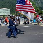 Coast Guardsmen march in the Juneau Fourth of July parade on July 4, 2021. (Dana Zigmund / Juneau Empire)