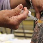 In this Juneau Empire file photo, Department of Veterans Affairs nurse Dale Cotton administers a dose of Johnson & Johnson COVID-19 vaccine. (Ben Hohenstatt / Juneau Empire)