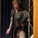 A bottle-clutching Caliban (Ben Krall) cackles in celebration of new-found freedom and libation during a Monday rehearsal performance of The Tempest held in McPhetres Hall. (Ben Hohenstatt / Juneau Empire)