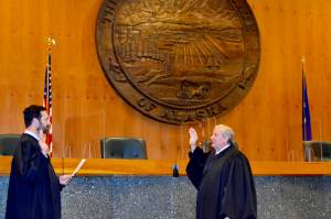 Courtesy photo / Alaska Court System 
Chief Justice Daniel E. Winfree, right, is sword in by Justice Dario Borghesan in Anchorage on July 1. Winfree will take over after former Chief Justice Joel Bolger retired earlier this year.