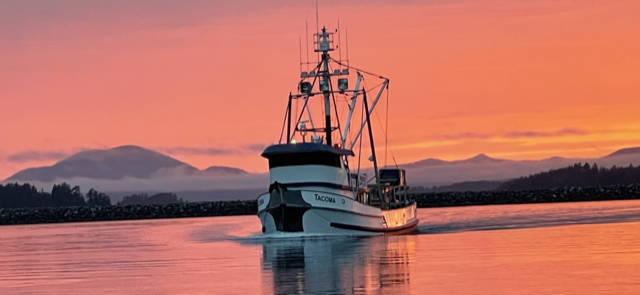 This photo shows a boat against the backdrop of a colorful sky. (Courtesy Photo Dave Diver Dave Sulser)
