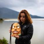 In 2020, Sienna Reid of Sitka and Andrea Cook, Tsaak Ka Juu of Hydaburg, pictured here holding her first carved mask, worked with the First Alaskans Institute, Sitka Conservation Society, the Pacific Northwest Research Lab and SSP to document the social, economic, and cultural value of red and yellow cedar to Alaska Native artisans and communities. (Courtesy Photo / Bethany Sonsini Goodrich)
