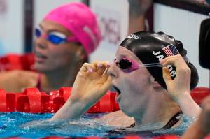 Lydia Jacoby of the United States, sees the results after winning the final of the womens 100-meter breaststroke at the 2020 Summer Olympics, Tuesday, July 27, 2021, in Tokyo, Japan. (AP Photo / Martin Meissner)