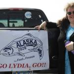 Sarah Spanos displays signs of support for Olympic swimmer Lydia Jacoby adorning her pickup truck, in Seward, Alaska, Tuesday, July 27, 2021. Jacoby, a 17-year-old from Seward, scored a major upset when the first Alaskan ever on the U.S. Olympics swimming team won the gold medal in the 100-meter breaststroke at the Tokyo Games. (AP Photo/Mark Thiessen)
