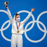 Gold medalist Lydia Jacoby of the United States celebrates on the podium after the final of the womens 100-meter breaststroke at the 2020 Summer Olympics, Tuesday, July 27, 2021, in Tokyo, Japan.(AP Photo / Matthias Schrader)
