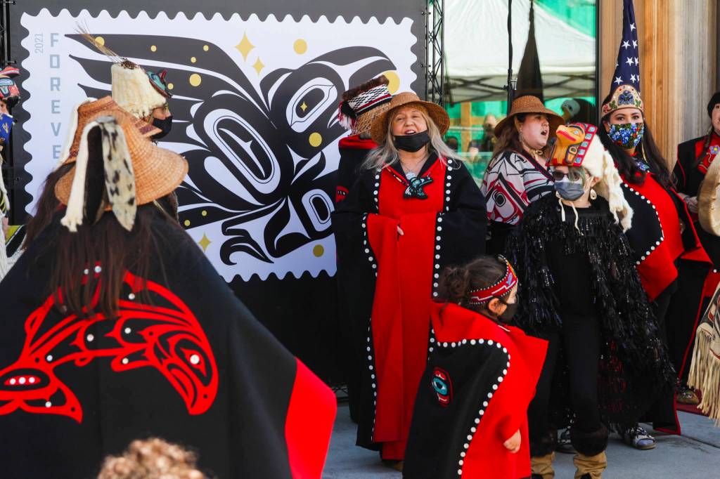 Michael S. Lockett / Juneau Empire 
Dancers perform during an official release ceremony for the Raven Story stamp in front of the Sealaska Heritage Institutes Walter Soboleff Building on Friday, July 30, 2021.