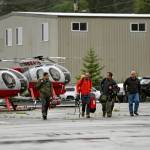Ketchikan Volunteer Rescue Squad personnel land and disembark from a Hughes 369D helicopter on Thursday, Aug. 5, 2021, at Temsco Helicopters Inc in Ketchikan, Alaska. The KVRS, U.S. Coast Guard, Alaska State Troopers and U.S. Forest Service responded to a radio beacon alert from a downed Southeast Aviation de Havilland Beaver float plane that was carrying five passengers from the Holland America Line cruise ship Nieuw Amsterdam, according to Coast Guard, Holland America and KVRS information. The sightseeing plane crashed Thursday in southeast Alaska, killing all six people on board, the U.S. Coast Guard said. (Dustin Safranek / Ketchikan Daily News)
Ketchikan Volunteer Rescue Squad personnel land and disembark from a Hughes 369D helicopter on Thursday, Aug. 5, 2021, at Temsco Helicopters Inc in Ketchikan, Alaska. The KVRS, U.S. Coast Guard, Alaska State Troopers and U.S. Forest Service responded to a radio beacon alert from a downed Southeast Aviation de Havilland Beaver float plane that was carrying five passengers from the Holland America Line cruise ship Nieuw Amsterdam, according to Coast Guard, Holland America and KVRS information. The sightseeing plane crashed Thursday in southeast Alaska, killing all six people on board, the U.S. Coast Guard said. (Dustin Safranek / Ketchikan Daily News)