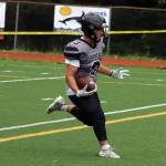 Gaby Soto crosses the goalline to put six points on the board for the Huskies in Juneau's first high school football game in nearly two years. Soto scored three touchdowns for the Huskies in the first half. (Ben Hohenstatt / Juneau Empire)